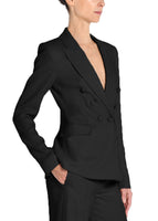A side view  image of a model wearing a black, double breasted blazer. 