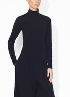 An angled view of a black turtleneck.