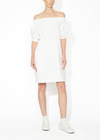 A front view of an ivory off the shoulder dress. 
